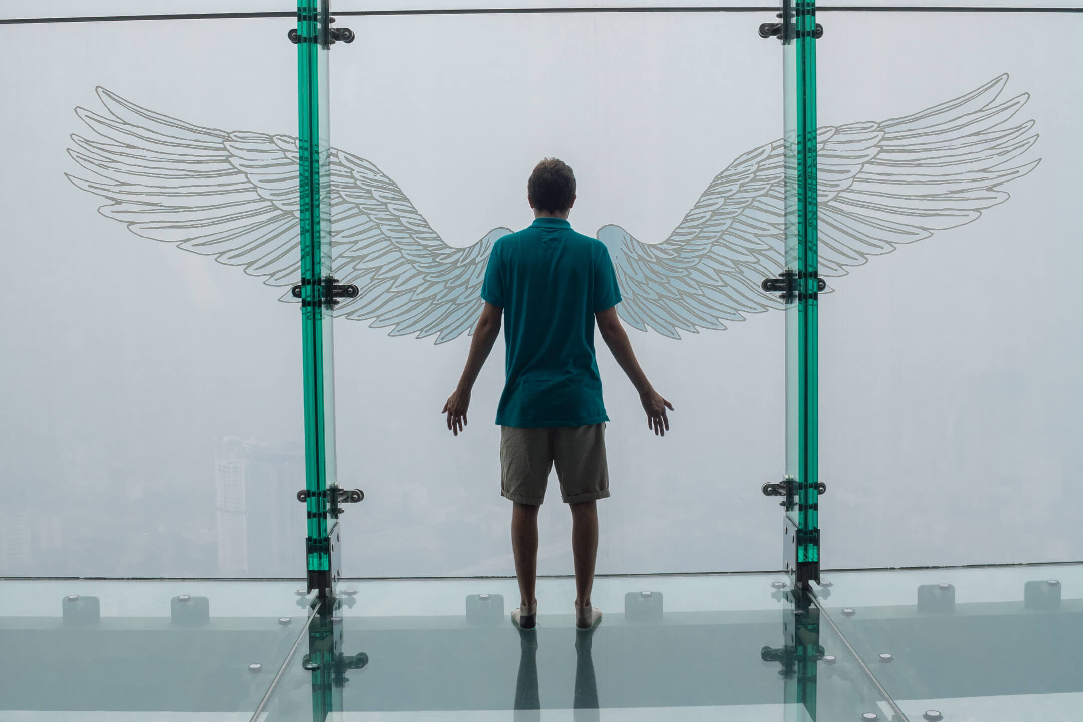 Man looking out over Hanoi City from Lotte Tower