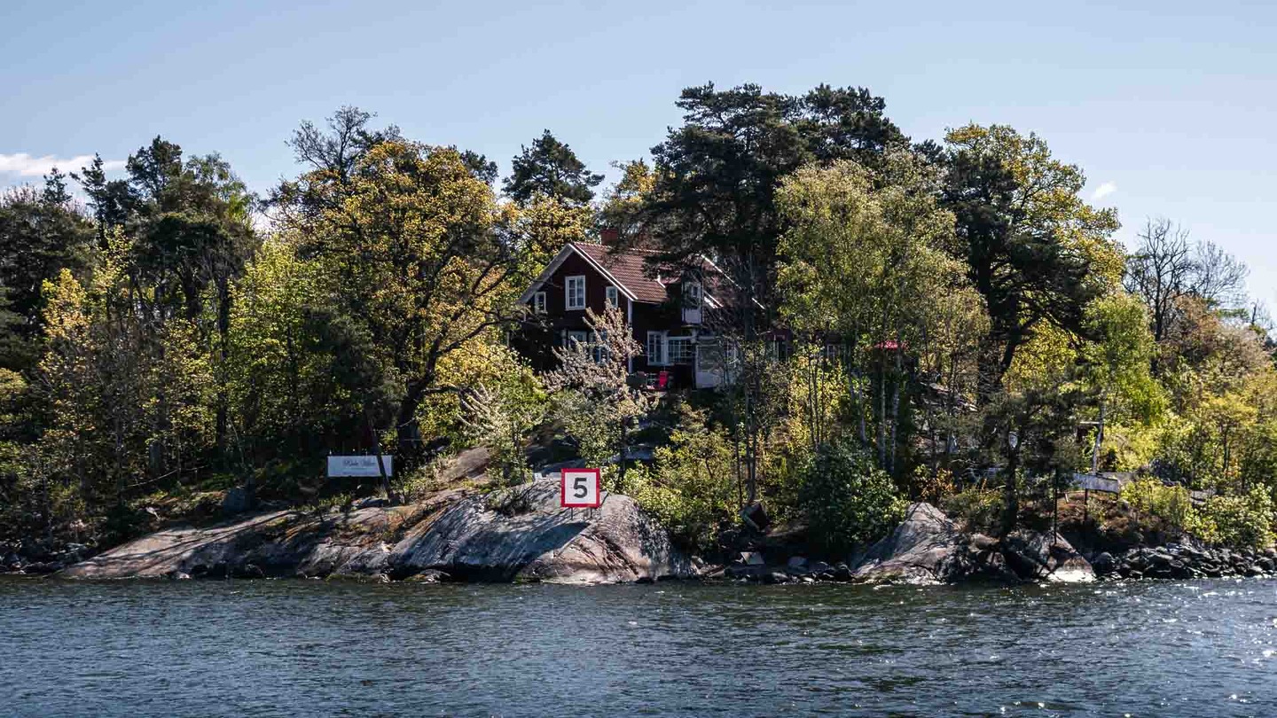Red house surrounded by trees in Stockholm, Sweden